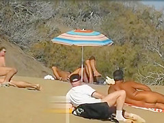 Slutwife masturbating for pervs in a beach