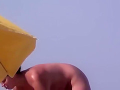 three asses in nude beach sea