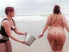 Fat slut takes lezom on the beach