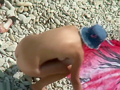 busty girl naked on the beach