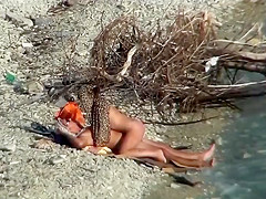 Couple fucking on a public beach, while walking past people