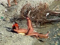 Couple fucking on a public beach, while walking past people