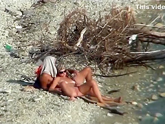 Couple fucking on a public beach, while walking past people