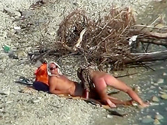 Couple fucking on a public beach, while walking past people