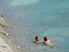 Couple fucked on a public beach while as people walked near