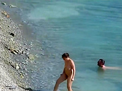 Couple fucked on a public beach while as people walked near
