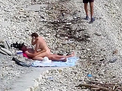 Couple fucked on a public beach while as people walked near