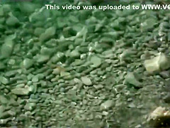 Voyeur. Mature woman have sex with a man at a public beach