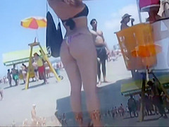 Delicious butt in thong on the beach !