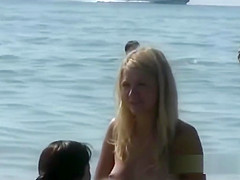 Beautiful fresh faced teen plays at the beach nude