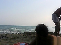 Several sexy nude girls caught on a beach with a spy cam