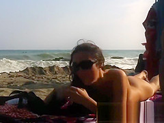 Several sexy nude girls caught on a beach with a spy cam