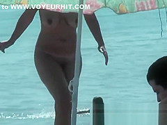 Public nudity scene with naked sexy nudist brunette