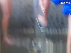 Spy cam shot of a hot nudist babe tanning on the beach