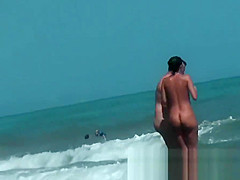 Sexy beach nudist girls get their hot booties admired