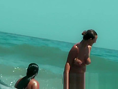 Sexy beach nudist girls get their hot booties admired