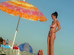 Sexy beach nudist women putting on lotion caught by spy cam