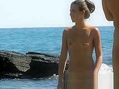 The pretty beach nudist girl has something