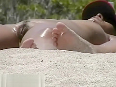 A couple of shameless nudists on the beach