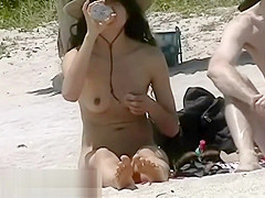 A couple of shameless nudists on the beach