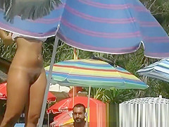 Sexy nudist chicks are captured on camera on a beach