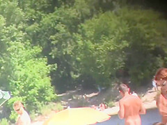 Nude Tanya playing frisbee on the beach