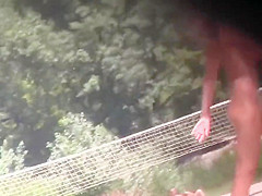 Nude Tanya playing frisbee on the beach