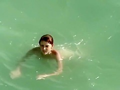 Young Couple On The Nude Beach