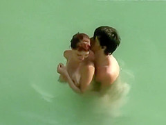 Young Couple On The Nude Beach