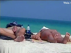 randy voyeur using his hidden cam to film girls on a nude beach