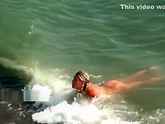 Nudist girls expose bodies at the beach