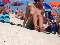Beautiful Latina showing her pussy on nude beach