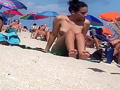 Beautiful Latina showing her pussy on nude beach