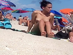 Beautiful Latina showing her pussy on nude beach