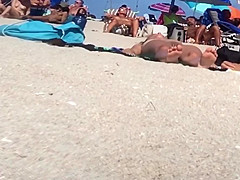 Beautiful Latina showing her pussy on nude beach