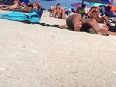 Beautiful Latina showing her pussy on nude beach