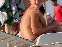 Big busty topless babes on the beach