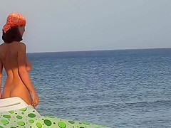 Perfect slim girl playing on the beach