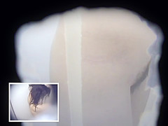 Two Asian Women in a Cramped Bathroom