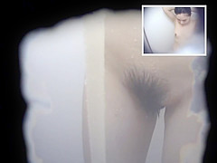 Two Asian Women in a Cramped Bathroom