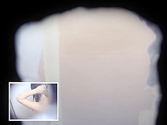 Two Asian Women in a Cramped Bathroom