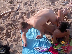 Spying on a horny couple fucking on the beach