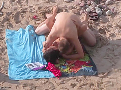 Spying on a horny couple fucking on the beach