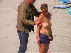 German milf on french beach spy. Shaky quality.