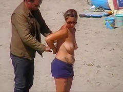 German milf on french beach spy. Shaky quality.