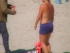 German milf on french beach spy. Shaky quality.