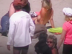German milf on french beach spy. Shaky quality.