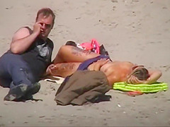 German milf on french beach spy. Shaky quality.