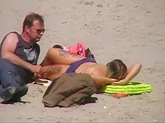 German milf on french beach spy. Shaky quality.