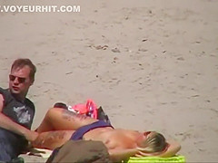 German milf on french beach spy. Shaky quality.
